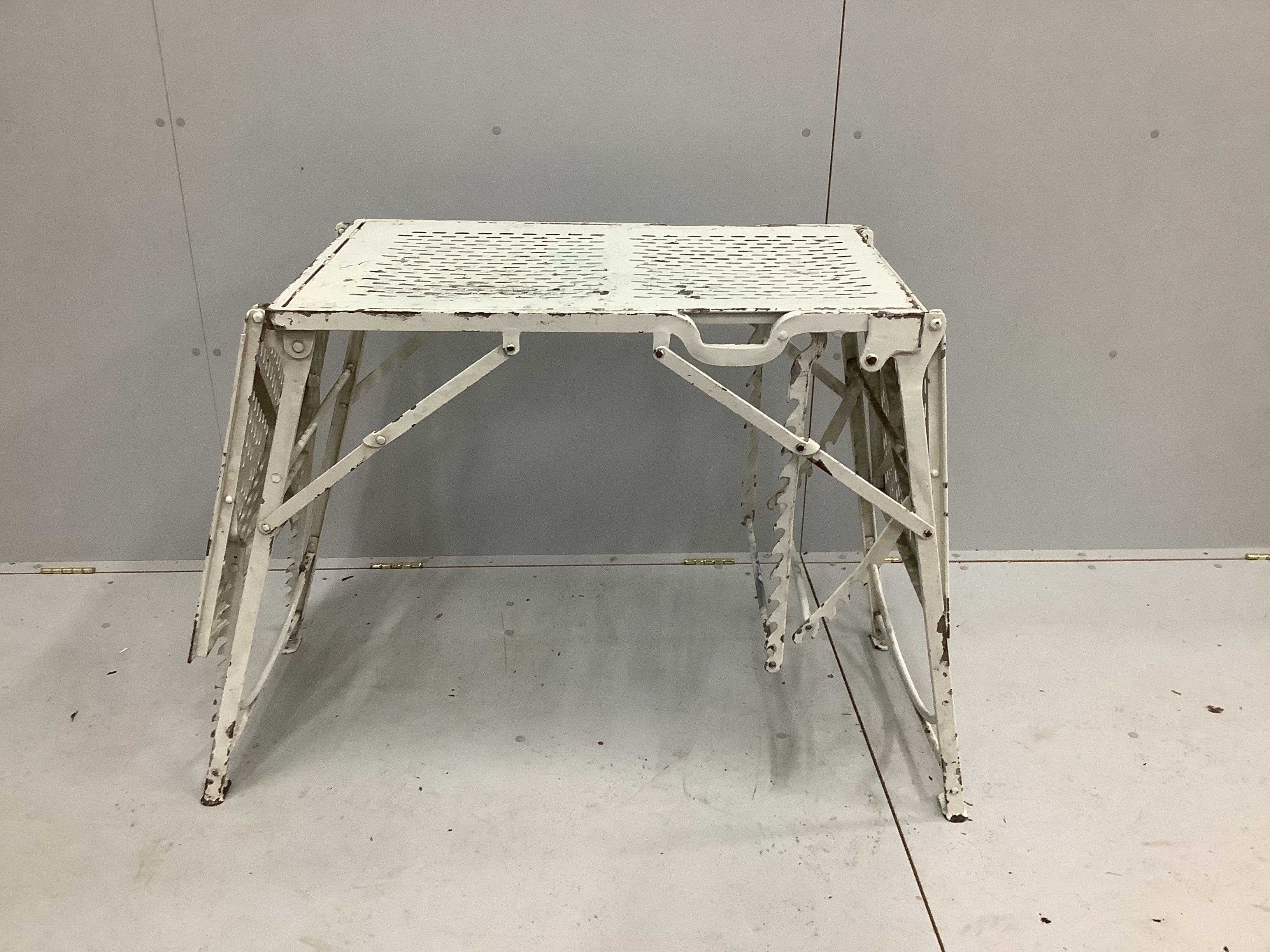 A vintage metal doctor's examination table